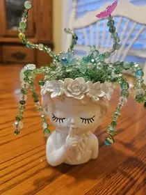 Face planter with beaded greenery